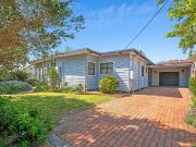 LOOKS CAN BE DECEIVING – SPACIOUS HOME CLOSE TO TOWN!
