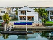 LUXURY WATERFRONT LIVING | INFINITY POOL, SOLAR POWER &...