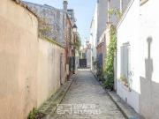 Maison à bâtir au coeur d'un passage