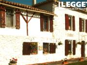 Maison de maître en pierre au bout d'un village,...