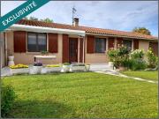 Maison de plain pied avec un grand garage et un puit sur...