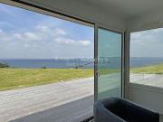 Maison en bord de mer avec jardin