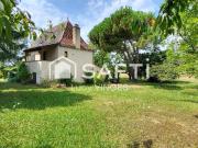 Maison en pierre avec garage et terrain