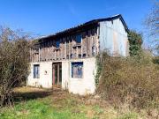 Maison en pierres avec dépendances avec terrain