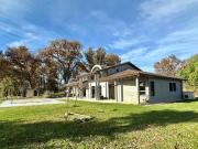 MAISON OSSATURE BOIS DANS UN ENVIRONNEMENT BOISE AVEC...