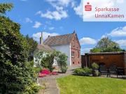 Malerisches Zweifamilienhaus auf parkähnlichem Grundstück
