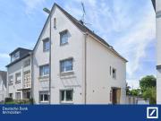 Mehrfamilienhaus mit Gewerbeanbau, Doppelgarage und Garten