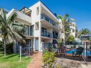 Metres from Town Beach  coveted surfside living