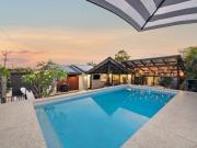 MODERN COASTAL HAVEN ON A CORNER BLOCK