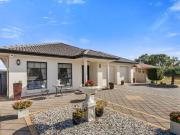 Modern comfort meets a generous 215sqm of family...