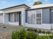 Modern comfort meets low maintenance living in a prime...