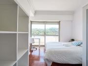 Modern double bedroom with balcony in Alto dos Moinhos...