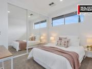 MODERN, LOW MAINTENANCE LIVING IN A WONDERFUL LOCATION!