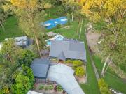 Modern Resort Style Home on Park Like Acre