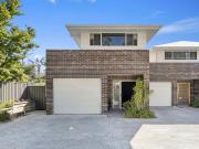 Modern, Spacious & Low Maintenance Living in a...