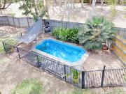 Modern, tidy & private half duplex for sale with a pool!