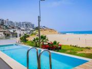 Moderna y linda casa en primera fila playa Caballeros