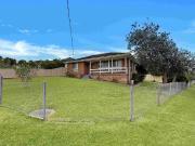 NEAT HOME IN HANDY LOCATION