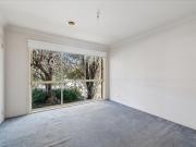 Neat Single Level Unit with Private Backyard