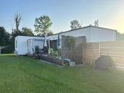 Neuwertiger Holz Bungalow mit großem Garten