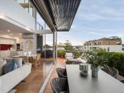 North facing split level penthouse showcasing city...