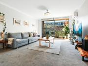 North facing two bedroom apartment w/ parking & garden views