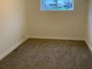A bedroom in a basement suite – Quiet, Private, All...