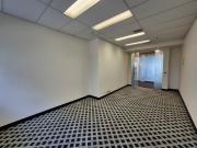 Open plan office with windows in Iconic 1 Queens Road