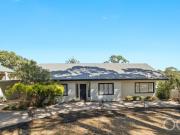 Open the Door to a Cottage Reborn in Nature's Vast...