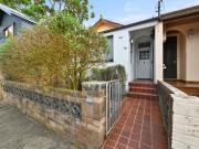 Original Semi with Rear Lane Access & Unlimited Potential