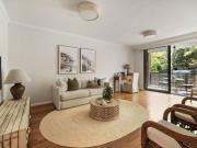 Oversized courtyard apartment in prized `Cambridge...