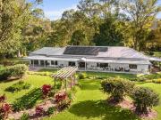 Private Gated Retreat with Expansive Grounds and Modern...