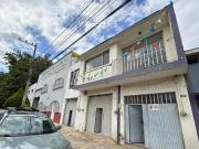 PROPIEDAD CON LOCALES COMERCIALES Y DEPARTAMENTO EN COL....