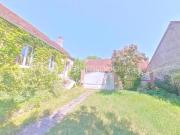 Propriété comprenant deux habitations avec cave et jardin