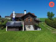 Pucking: Blockbohlenhaus mit sonnigem Freizeitgrundstück...