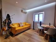 Quarto em apartamento com vista de rio