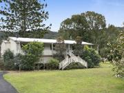 RARE CREEKSIDE RETREAT WITH 3.2 ACRES OF USABLE LAND