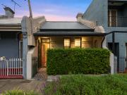 Refined 5m wide period home with rear lane parking access