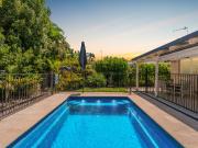 RELAXED COASTAL LIVING WITH TROPICAL POOLSIDE OASIS