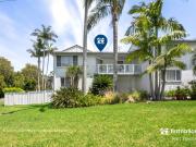 Relaxed Coastal Retreat with Garage & Spacious Interiors