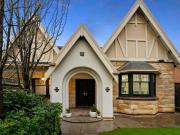 Renovated Tudor Residence: Abundant Charm and Stunning Style