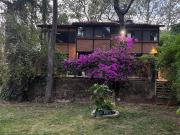 Residencia en medio del bosque con amplio jardín