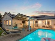 Resort Style Family Entertainer with Poolside Appeal in...