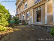 Rez de jardin avec garages, proche centre