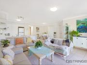 Sunlit Top Floor Unit Offering Prime Location & Coastal...
