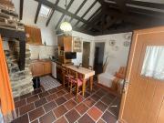 Rustic home overlooking a common swimming pool