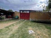 Se vende terreno bardeado con 4 cuartos y cisterna en la...