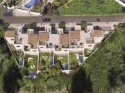 Seis moradias modernas e geminadas, cada uma com um...