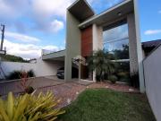 Sobrado moderno com 2 suítes, solarium e pátio Bairro...