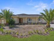 Solid Brick Family Home with exceptional Garaging only...